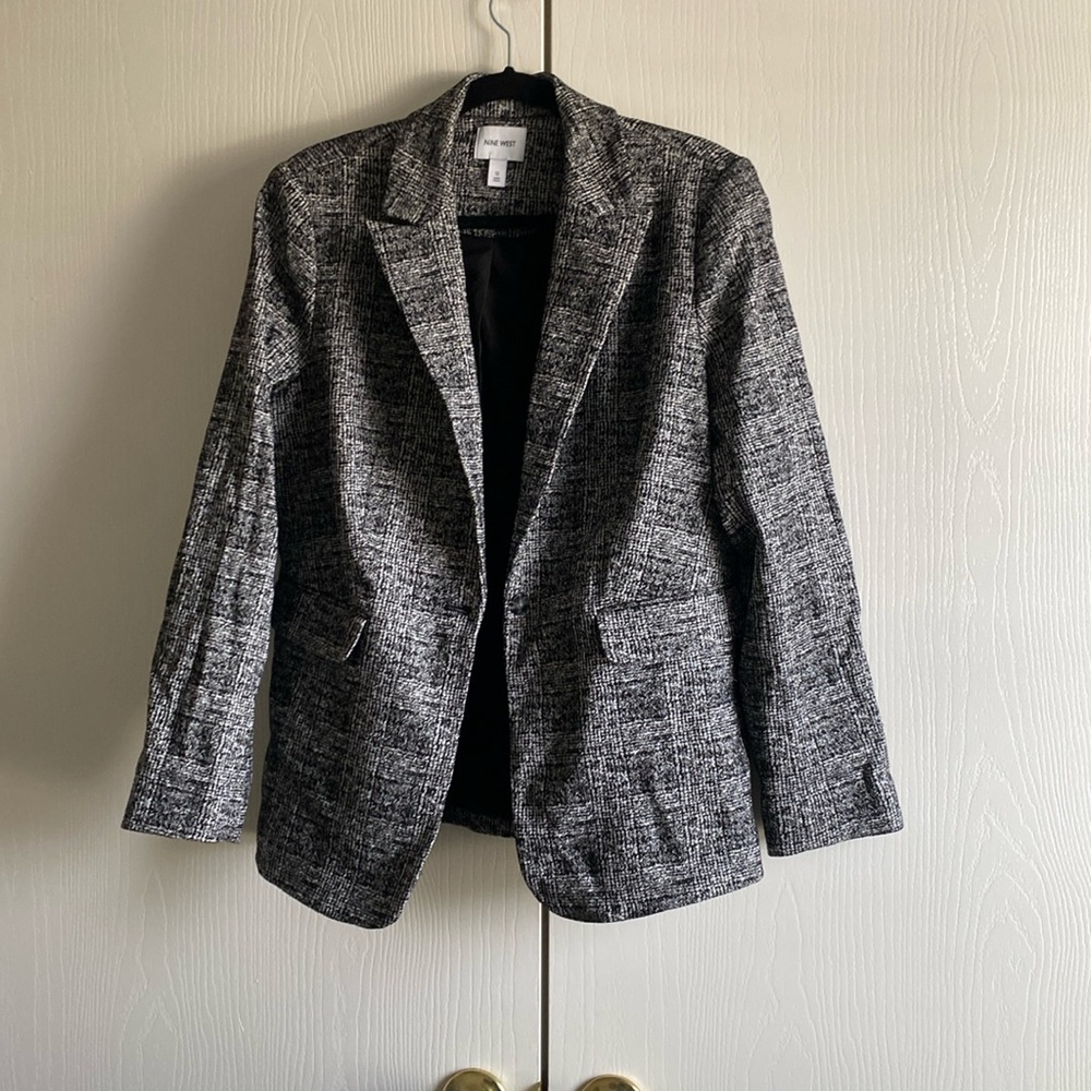This is a Nine West blazer with shoulder pads. Never worn.